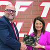 Cache Superintendent Chad Hance awards Cache District Teacher of the Year to Stacy Robinson.